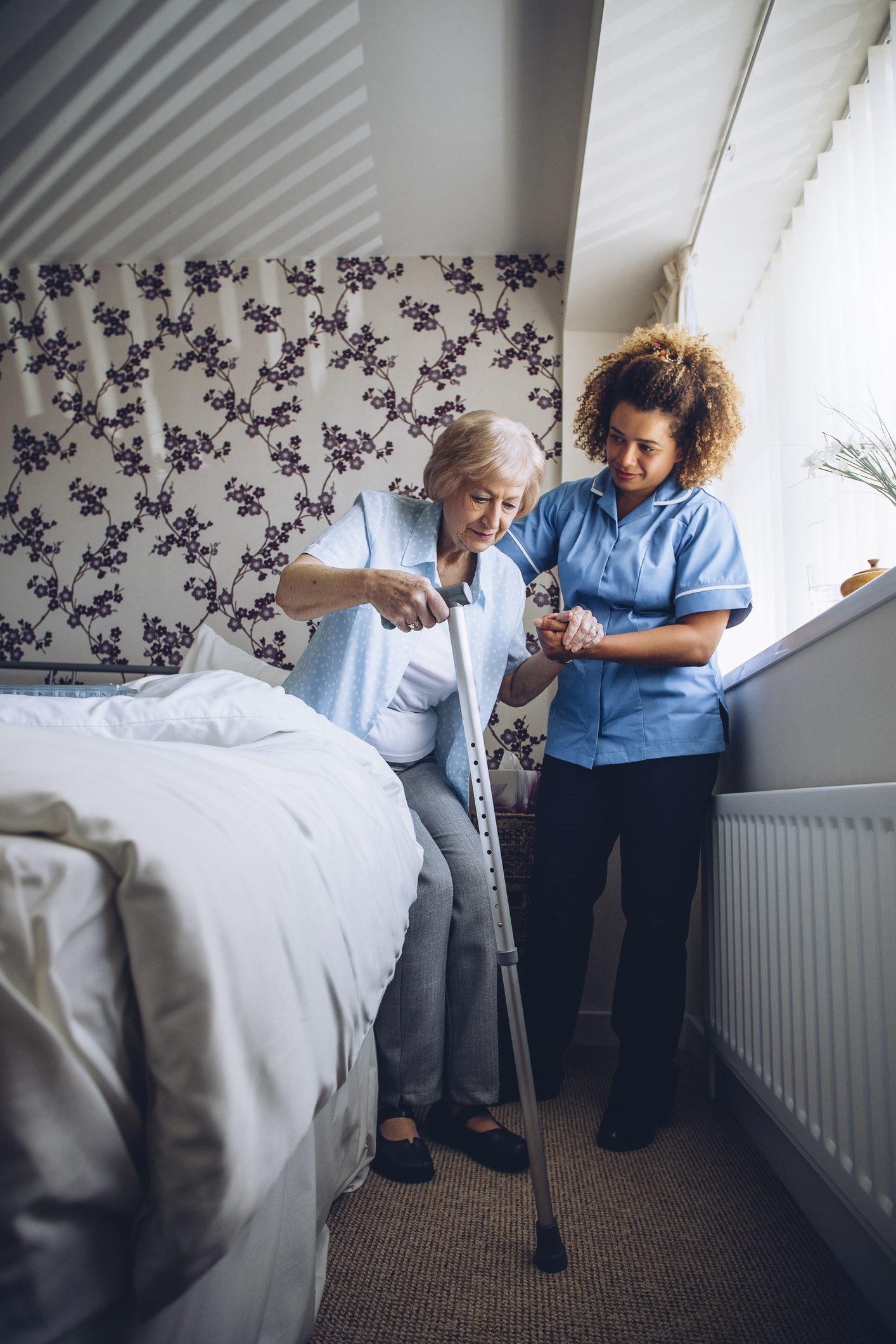 Caregiver Assisting a Senior Woman